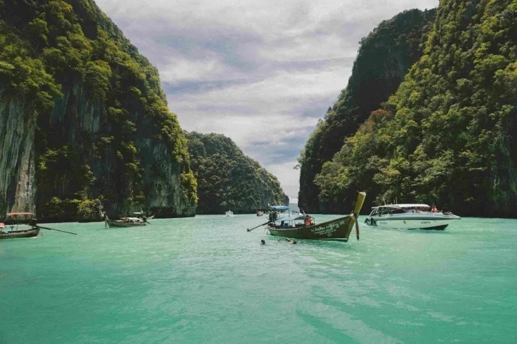 Calm turquoise lagoon between limestone cliffs